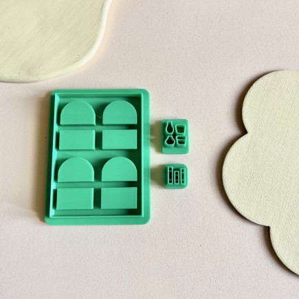 Set cortadores para arcilla polimérica estantería con libros